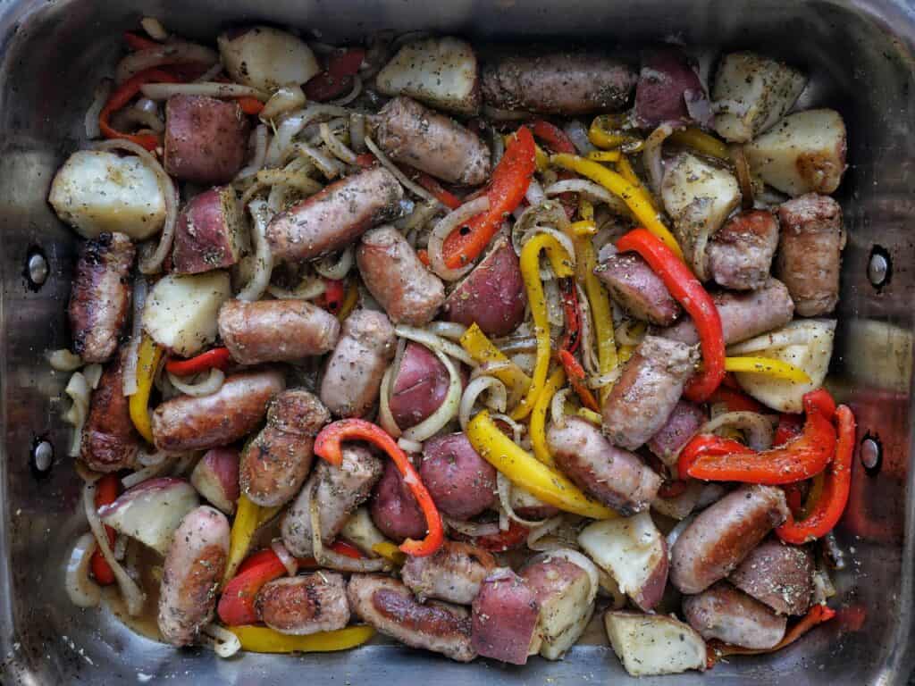 sausages peppers and potatoes ready to bake
