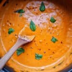 vodka sauce in a pot with basil and red pepper flakes